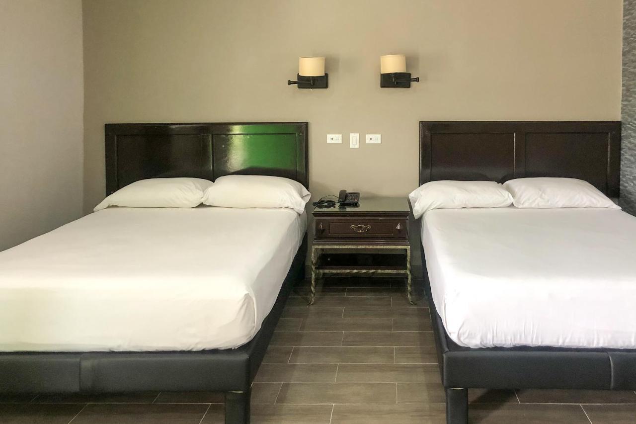 Capital O Palms Hotel, Acuna Ciudad Acuña エクステリア 写真